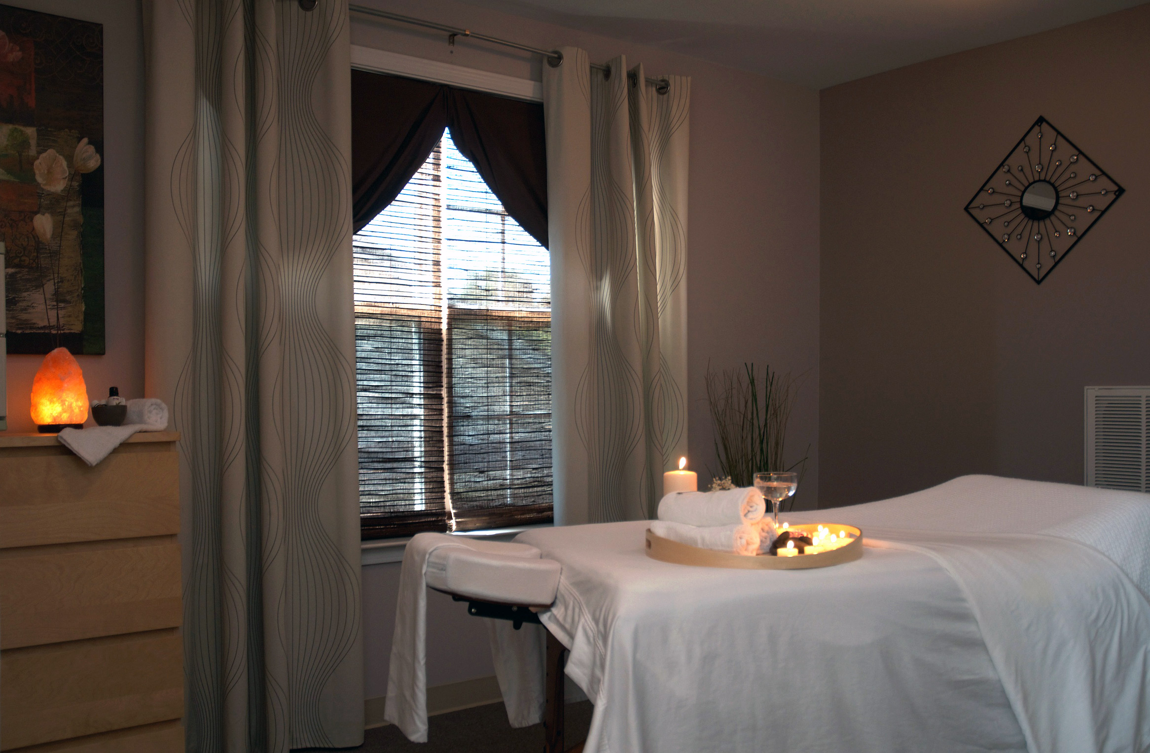 massage room with table and ambient lighting